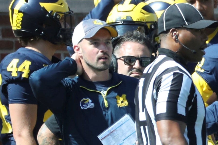 Michigan football staffer Connor Stalions sign-stealing during a game