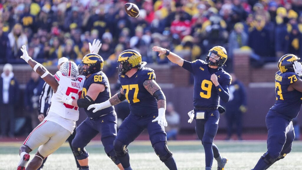 Michigan QB JJ McCarthy passes against Ohio State. He has an NFL decision to make