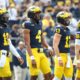 Michigan quarterbacks Alex Orji (10), Jayden Denegal (4), Jack Tuttle (13) and Davis Warren (16) practice before the UNLV game at Michigan Stadium in Ann Arbor on Saturday, Sept. 9, 2023.