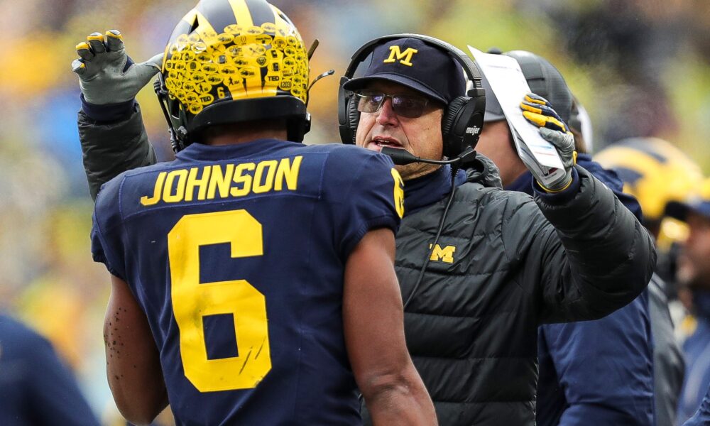 Michigan coach Jim Harbaugh celebrates a play against Indiana with wide receiver Cornelius Johnson during the first half of U-M's 52-7 win over Indiana on Saturday, Oct. 14, 2023, in Ann Arbor.