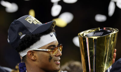 Jan 8, 2024; Houston, TX, USA; Michigan Wolverines defensive back Will Johnson (2) holds the National Championship Trophy after winning 2024 College Football Playoff national championship game against the Washington Huskies at NRG Stadium. Mandatory Credit: Thomas Shea-USA TODAY Sports