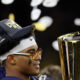 Jan 8, 2024; Houston, TX, USA; Michigan Wolverines defensive back Will Johnson (2) holds the National Championship Trophy after winning 2024 College Football Playoff national championship game against the Washington Huskies at NRG Stadium. Mandatory Credit: Thomas Shea-USA TODAY Sports