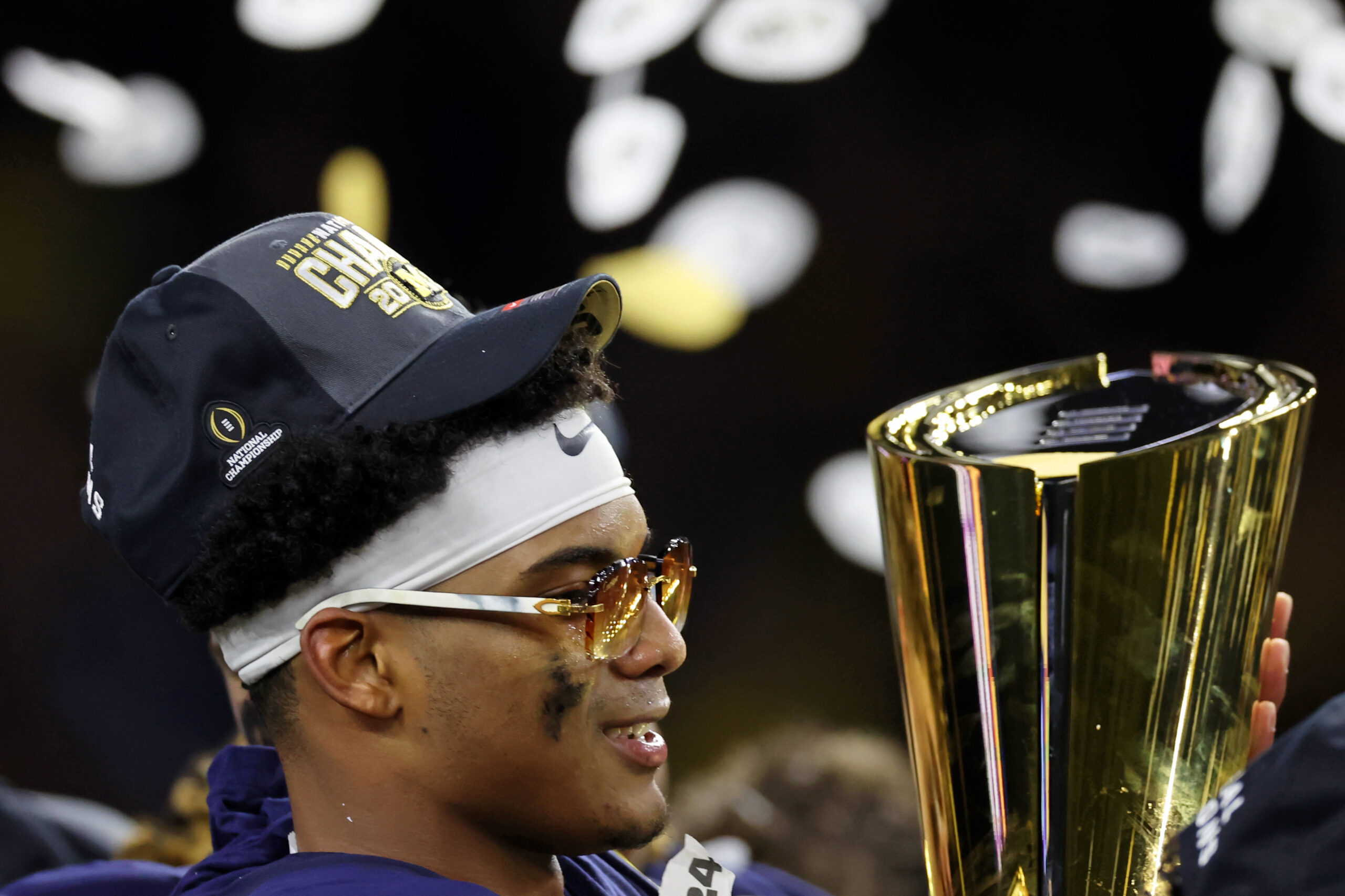 Jan 8, 2024; Houston, TX, USA; Michigan Wolverines defensive back Will Johnson (2) holds the National Championship Trophy after winning 2024 College Football Playoff national championship game against the Washington Huskies at NRG Stadium. Mandatory Credit: Thomas Shea-USA TODAY Sports