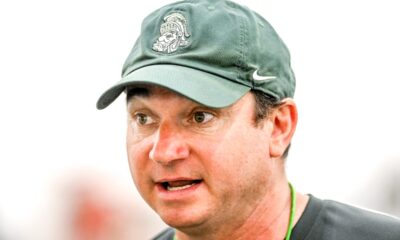 Michigan State's head coach Jonathan Smith talks with the team during camp on Monday, Aug. 5, 2024, at the indoor practice facility in East Lansing.