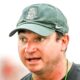 Michigan State's head coach Jonathan Smith talks with the team during camp on Monday, Aug. 5, 2024, at the indoor practice facility in East Lansing.