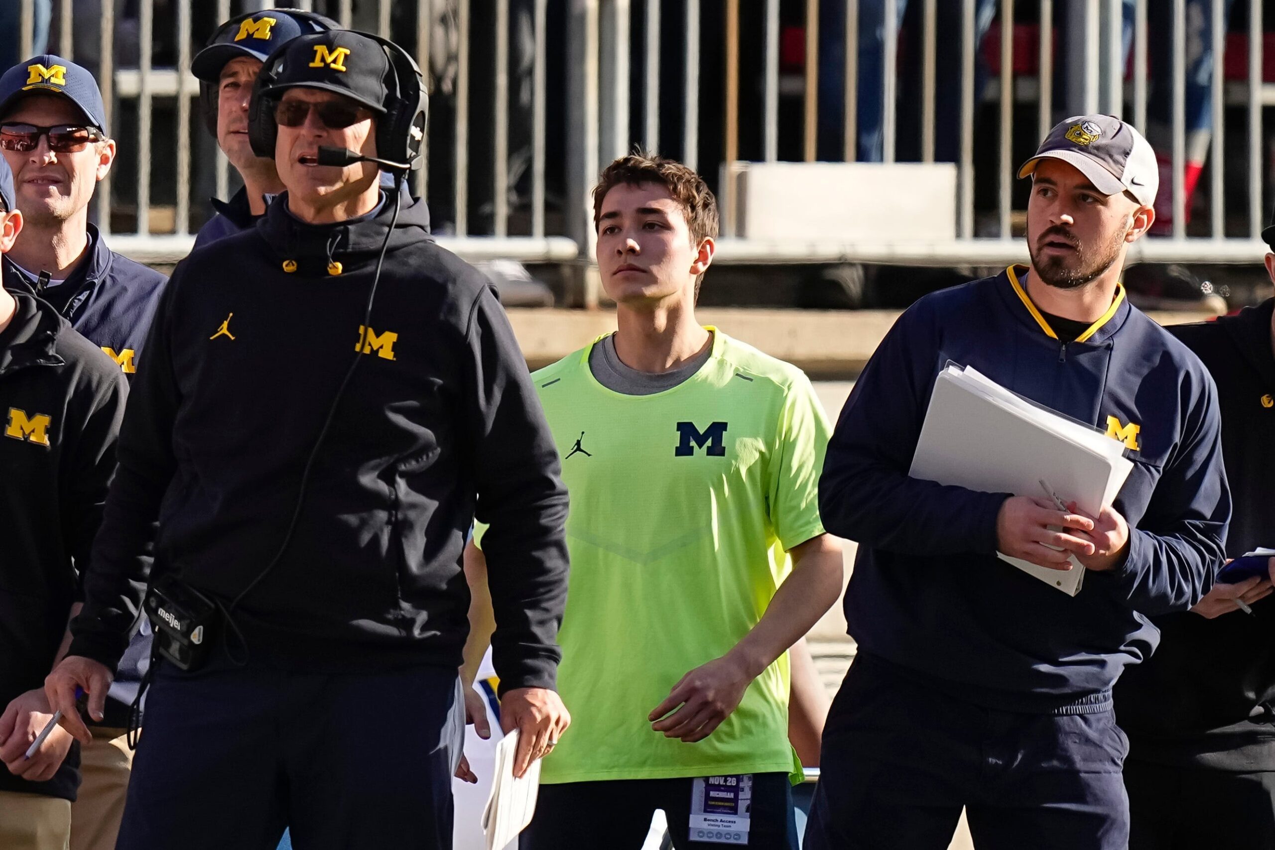 Michigan Wolverines head coach Jim Harbaugh watches from the sideline beside off-field analyst Connor Stalions, right, during a game against the Ohio State Buckeyes at Ohio Stadium in 2022.