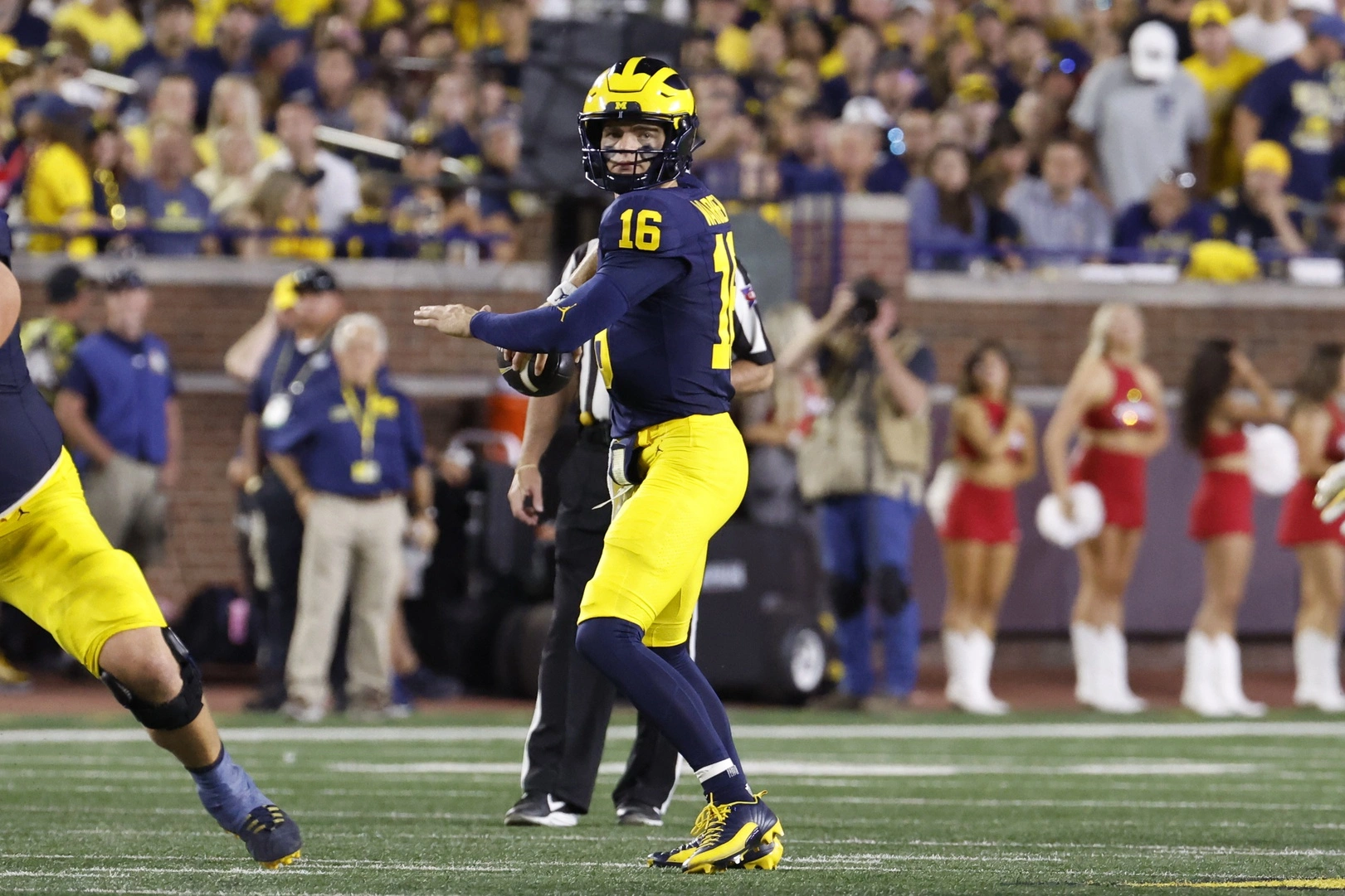 Davis Warren drops back for a pass in Michigan football vs fresno state