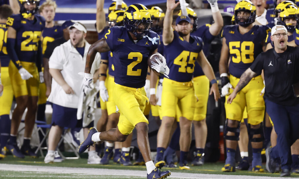 Aug 31, 2024; Ann Arbor, Michigan, USA; Michigan Wolverines defensive back Will Johnson (2) runs the ball after he makes an interception in the second half against the Fresno State Bulldogs at Michigan Stadium. Mandatory Credit: Rick Osentoski-USA TODAY Sports