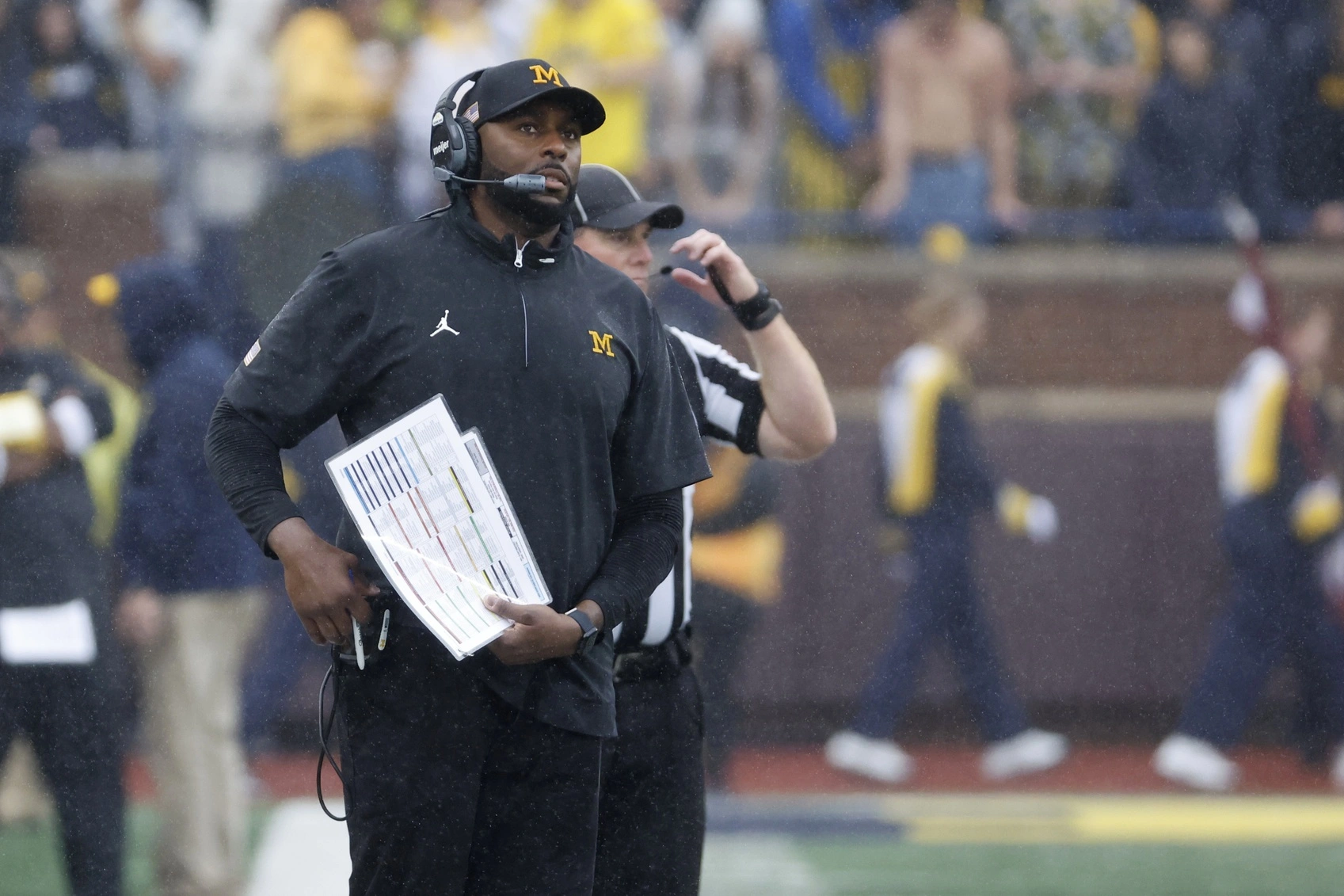 Michigan football head coach Sherrone Moore watches their game vs Minnesota