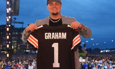 Mason Graham posing at the 2025 NFL Draft with his Cleveland Browns jersey