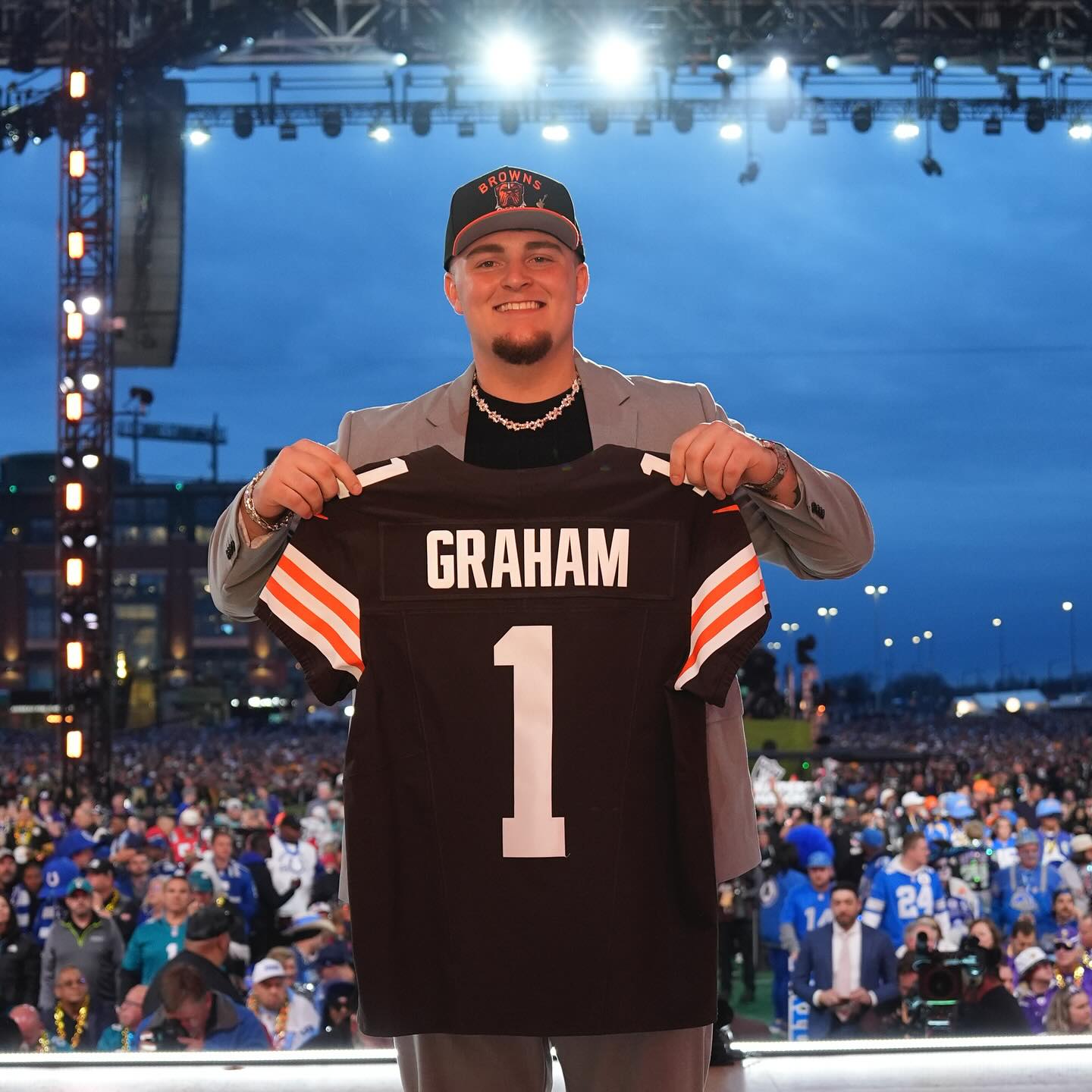 Mason Graham posing at the 2025 NFL Draft with his Cleveland Browns jersey