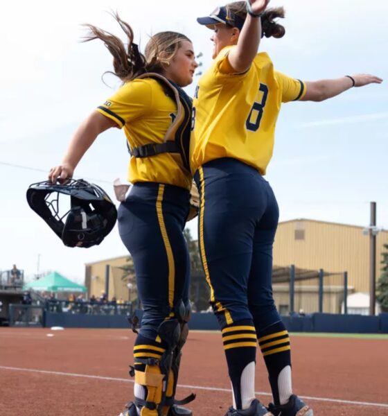 Pitchers Erin Hoehn and Lauren Derkowski celebrate their upset of top seed Oregon