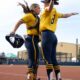 Pitchers Erin Hoehn and Lauren Derkowski celebrate their upset of top seed Oregon