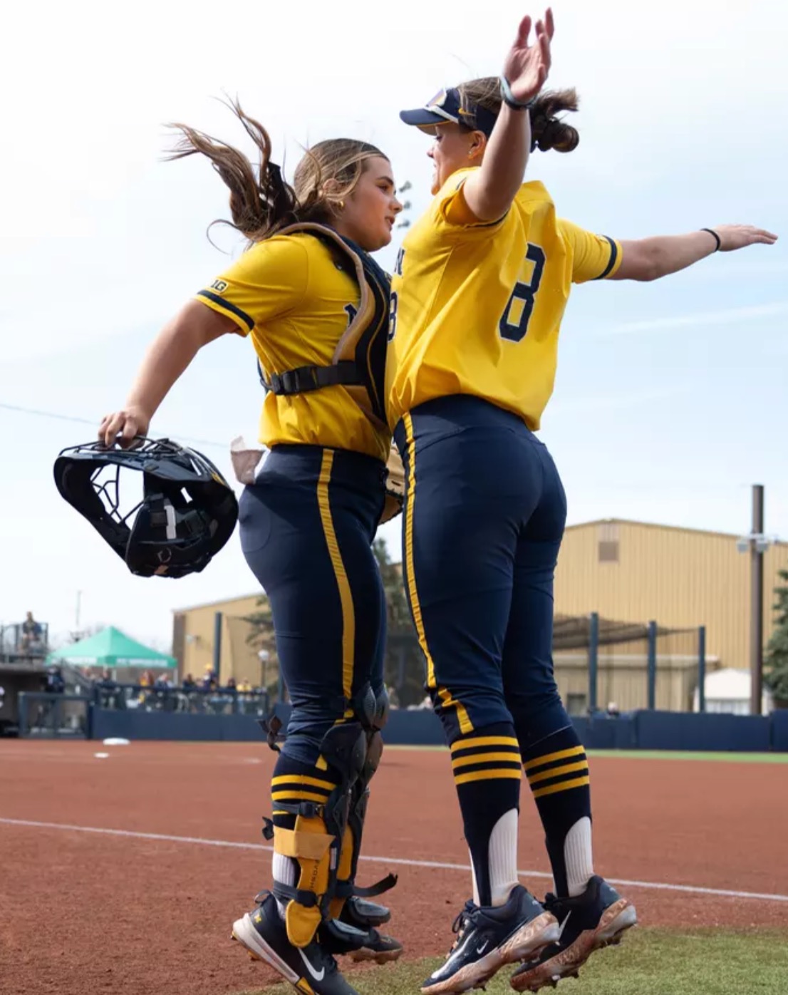 Pitchers Erin Hoehn and Lauren Derkowski celebrate their upset of top seed Oregon