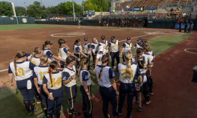 Michigan Softball huddled together before their final game of the season