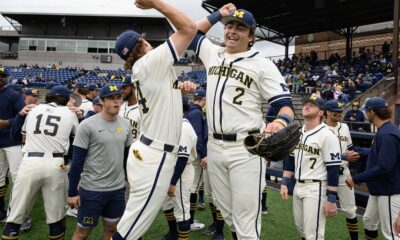 Michigan baseball squad celebrating after winning their final game of the regular season