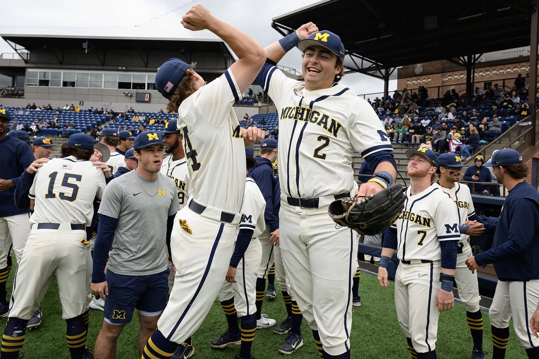 Michigan baseball squad celebrating after winning their final game of the regular season